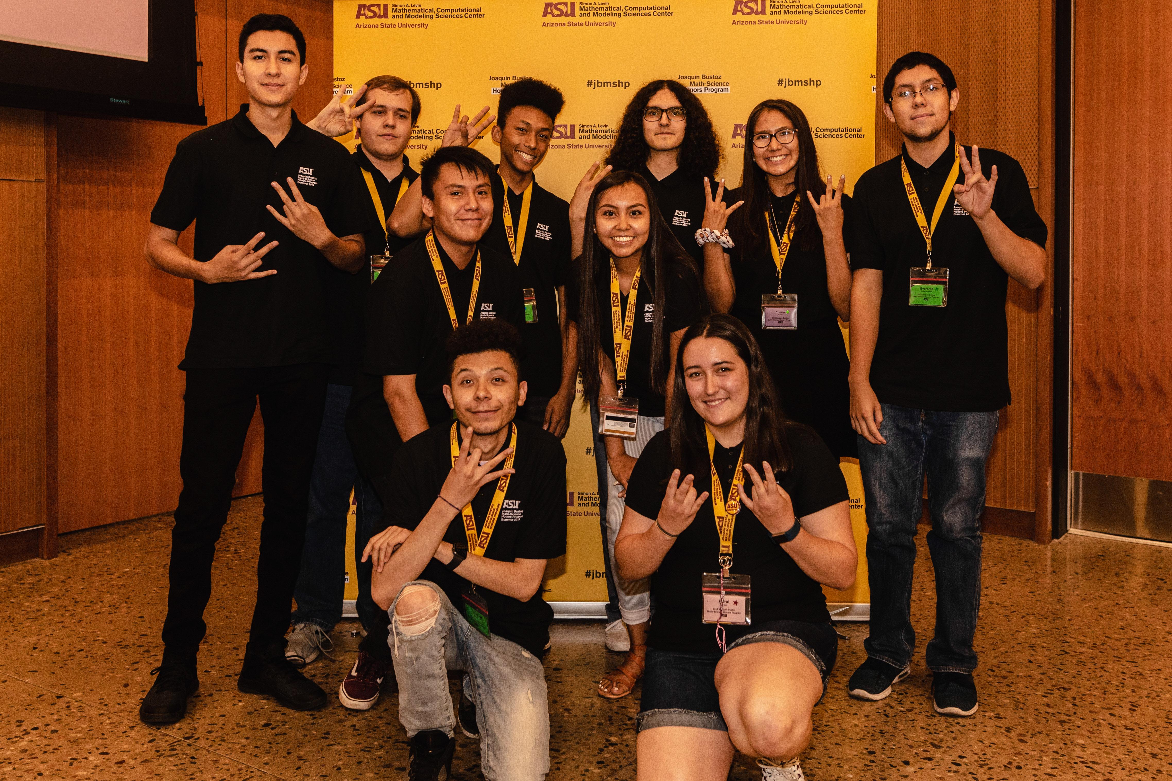 Students in front of banner
